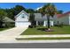 Charming single-Gathering home featuring a well-manicured lawn, and attached two car garage at 7517 Whispering Oak Dr, Hanahan, SC 29410