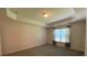 Spacious bedroom featuring neutral walls, cozy carpet, and bright window at 7517 Whispering Oak Dr, Hanahan, SC 29410