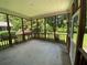 Inviting screened porch, perfect for enjoying the outdoors in comfort at 7517 Whispering Oak Dr, Hanahan, SC 29410