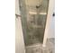 Large walk-in shower with glass door, overhead shower head and convenient grab bar at 7517 Whispering Oak Dr, Hanahan, SC 29410