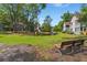Scenic backyard view of a townhouse complex featuring a well-manicured lawn near a tranquil pond at 7921 Cricket Ct # 305 E, North Charleston, SC 29418