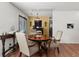 Dining area with wood table, chairs and view to the outdoor deck at 7921 Cricket Ct # 305 E, North Charleston, SC 29418