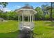 Picturesque gazebo nestled in a green lawn with mature trees, perfect for relaxation or outdoor gatherings at 7921 Cricket Ct # 305 E, North Charleston, SC 29418