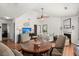Bright living room with vaulted ceilings, hardwood floors, and a cozy fireplace at 7921 Cricket Ct # 305 E, North Charleston, SC 29418