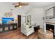 Living room featuring a fireplace, TV, and a comfortable seating area at 7921 Cricket Ct # 305 E, North Charleston, SC 29418
