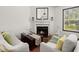 Bright living room highlighting the fireplace, sofas, and decor at 7921 Cricket Ct # 305 E, North Charleston, SC 29418