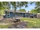 Expansive backyard featuring blue siding, mature trees, and space for outdoor gatherings at 809 O'Sullivan Dr, Mount Pleasant, SC 29464