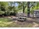 Backyard features mature trees, a wooden fence, and a picnic table at 809 O'Sullivan Dr, Mount Pleasant, SC 29464