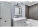 The bathroom features white cabinets and updated fixtures and vanity at 809 O'Sullivan Dr, Mount Pleasant, SC 29464