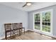 Bedroom with a ceiling fan, three chairs, and a large window overlooking the yard at 809 O'Sullivan Dr, Mount Pleasant, SC 29464