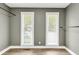 Empty walk-in closet with two windows and closet rods installed at 809 O'Sullivan Dr, Mount Pleasant, SC 29464