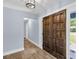 The foyer features hardwood floors, double doors, and a stylish light fixture at 809 O'Sullivan Dr, Mount Pleasant, SC 29464