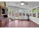 Sunlit sun room featuring brick floors, multiple windows, and a great view at 809 O'Sullivan Dr, Mount Pleasant, SC 29464