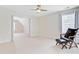 Bedroom features a ceiling fan, a comfortable armchair and light neutral carpet at 9524 Markley Blvd, Summerville, SC 29485