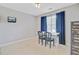 Bedroom featuring two chairs and desk with blue drapes and light carpet at 9524 Markley Blvd, Summerville, SC 29485