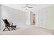 Bedroom features a ceiling fan, a comfortable armchair and light neutral carpet at 9524 Markley Blvd, Summerville, SC 29485