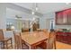 Bright dining room with table, chairs, stylish pendant lighting, and kitchen access at 9524 Markley Blvd, Summerville, SC 29485