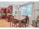 Inviting dining area featuring wood table, chairs, pendant lighting and natural light at 9524 Markley Blvd, Summerville, SC 29485