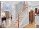 Entryway features high ceilings, hardwood floors, staircase and decorative lighting fixture at 9524 Markley Blvd, Summerville, SC 29485