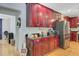 Kitchen features dark cabinets, stainless steel appliances, and hardwood floors at 9524 Markley Blvd, Summerville, SC 29485