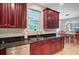 Beautiful kitchen with dark cabinets, stainless appliances, and a view into the dining area at 9524 Markley Blvd, Summerville, SC 29485