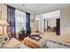 Open-concept living room featuring comfortable seating, large windows, and seamless flow to the dining area at 9524 Markley Blvd, Summerville, SC 29485