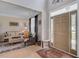 Inviting living room featuring a large front door and comfortable seating arrangement at 9524 Markley Blvd, Summerville, SC 29485