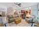 Comfortable seating arrangement with area rug in an open living room with kitchen access at 9524 Markley Blvd, Summerville, SC 29485