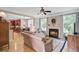 Cozy living room with a fireplace, comfortable seating, and open access to the kitchen at 9524 Markley Blvd, Summerville, SC 29485