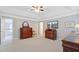 Expansive primary bedroom with tray ceilings, fan and furnishings offers an abundance of open space at 9524 Markley Blvd, Summerville, SC 29485