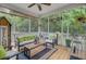Relaxing screened-in porch with comfortable seating, perfect for enjoying the outdoors while protected from the elements at 9524 Markley Blvd, Summerville, SC 29485