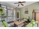Inviting porch with comfortable seating and ceiling fan, perfect for relaxing outdoors in comfort and style at 9524 Markley Blvd, Summerville, SC 29485