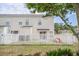 Backyard with a white picket fence and a view of the home's exterior at 1003 Washitonia Way # A, Charleston, SC 29492