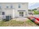 Fenced backyard with grass and patio, offering a private outdoor space at 1003 Washitonia Way # A, Charleston, SC 29492