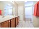 Well-lit bathroom with a double sink vanity and a shower/tub combination at 1003 Washitonia Way # A, Charleston, SC 29492
