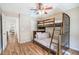 Bedroom with bunk beds, wood-look flooring, and a ceiling fan at 1003 Washitonia Way # A, Charleston, SC 29492