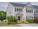 Charming townhome featuring neat landscaping, dark shutters, and a welcoming front entrance at 1003 Washitonia Way # A, Charleston, SC 29492