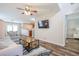 Open-concept living room with wood floors, modern decor, and ample natural light at 1003 Washitonia Way # A, Charleston, SC 29492