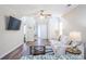 Relaxing living room with wood floors, neutral walls, ceiling fan, and an open layout at 1003 Washitonia Way # A, Charleston, SC 29492