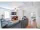 Open upstairs living area with wood floors, a large television, and comfortable seating at 1003 Washitonia Way # A, Charleston, SC 29492
