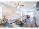 Cozy living room showing hardwood floors, an open layout, and a ceiling fan at 1003 Washitonia Way # A, Charleston, SC 29492