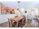 Open concept dining and living space with hardwood floors and lots of natural light at 1003 Washitonia Way # A, Charleston, SC 29492