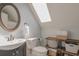 Bathroom in the attic, including sink, toilet, mirror and storage shelves at 1022 Hunley Waters Cir, North Charleston, SC 29405