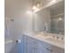 Bathroom featuring dual sinks, a large mirror, and a glass-enclosed shower at 1022 Hunley Waters Cir, North Charleston, SC 29405