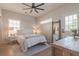 Bright bedroom with a ceiling fan and a door to access the outside at 1022 Hunley Waters Cir, North Charleston, SC 29405