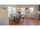 Bright dining area with modern lighting, views of the outdoors and an inviting space for Gathering and friends at 1022 Hunley Waters Cir, North Charleston, SC 29405