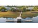 Picturesque dock and water view, inviting homeowners to enjoy the serenity and beauty of the natural surroundings at 1022 Hunley Waters Cir, North Charleston, SC 29405
