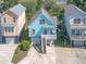 Charming coastal home with a covered porch, showcasing its elevated design, outdoor appeal and garage at 1022 Hunley Waters Cir, North Charleston, SC 29405