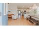 Open-concept living area with abundant natural light, stylish furnishings and a view into the modern kitchen at 1022 Hunley Waters Cir, North Charleston, SC 29405