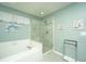 This bright bathroom features a tiled shower, large soaking tub, and tile flooring at 104 S Ansel Xing, Goose Creek, SC 29445